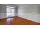 Formal dining room with hardwood floors and wainscoting at 1429 Wood Iris Ln, Lawrenceville, GA 30045