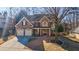 Two-story brick home with attached two-car garage at 1429 Wood Iris Ln, Lawrenceville, GA 30045