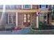 Double-door entry with a brick facade and sidelights at 1429 Wood Iris Ln, Lawrenceville, GA 30045