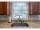 Kitchen sink and granite countertop at 1429 Wood Iris Ln, Lawrenceville, GA 30045