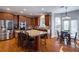 Kitchen with granite countertops, stainless steel appliances, and island at 1429 Wood Iris Ln, Lawrenceville, GA 30045