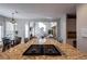 Kitchen with granite countertops, stainless steel appliances and island at 1429 Wood Iris Ln, Lawrenceville, GA 30045
