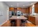 Well-equipped kitchen with granite island and stainless steel appliances at 1429 Wood Iris Ln, Lawrenceville, GA 30045