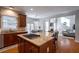 Spacious kitchen with granite countertops, island, and stainless steel appliances at 1429 Wood Iris Ln, Lawrenceville, GA 30045