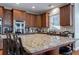 Large kitchen island with granite countertop and seating for four at 1429 Wood Iris Ln, Lawrenceville, GA 30045