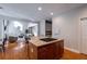 Island kitchen with granite countertops and stainless steel appliances at 1429 Wood Iris Ln, Lawrenceville, GA 30045