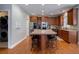 Kitchen with large island, granite counters, stainless steel appliances at 1429 Wood Iris Ln, Lawrenceville, GA 30045