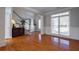 Hardwood floor living room with access to the backyard at 1429 Wood Iris Ln, Lawrenceville, GA 30045