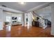 Spacious living room with hardwood floors and views to other rooms at 1429 Wood Iris Ln, Lawrenceville, GA 30045
