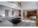 Open concept living area with hardwood floors and large sectional sofa at 1429 Wood Iris Ln, Lawrenceville, GA 30045