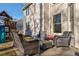 Relaxing patio area with wicker furniture and view of playset at 1429 Wood Iris Ln, Lawrenceville, GA 30045