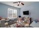 Bright playroom with toy storage and comfortable seating at 1429 Wood Iris Ln, Lawrenceville, GA 30045