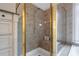 Walk-in shower with tiled walls and built-in seat at 1429 Wood Iris Ln, Lawrenceville, GA 30045