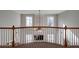 Open view from upstairs hallway to living room below at 1429 Wood Iris Ln, Lawrenceville, GA 30045