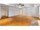 Spacious finished basement with wood floors and neutral walls at 6020 Cochran Mill Rd, Chattahoochee Hills, GA 30268