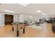 Spacious basement with a foosball table, living room area and home office setup at 6020 Cochran Mill Rd, Chattahoochee Hills, GA 30268