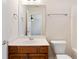 Bathroom featuring wood vanity, mirror, toilet and towel rack at 6020 Cochran Mill Rd, Chattahoochee Hills, GA 30268