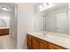 Bathroom featuring custom wood cabinetry, a large mirror, and tile flooring at 6020 Cochran Mill Rd, Chattahoochee Hills, GA 30268