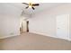 Large bedroom with neutral carpet, bright lighting, and a large closet at 6020 Cochran Mill Rd, Chattahoochee Hills, GA 30268