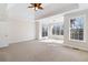 Bright room with large windows, neutral carpet, and ample space at 6020 Cochran Mill Rd, Chattahoochee Hills, GA 30268