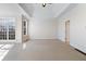 Inviting bedroom with tray ceiling and large windows showcasing the natural view at 6020 Cochran Mill Rd, Chattahoochee Hills, GA 30268