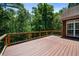 Expansive deck with wooded views, perfect for outdoor entertaining and enjoying nature at 6020 Cochran Mill Rd, Chattahoochee Hills, GA 30268