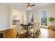 Inviting dining room with hardwood floors, ample natural light, and elegant furniture at 6020 Cochran Mill Rd, Chattahoochee Hills, GA 30268