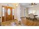 Elegant foyer featuring a decorative front door, tile flooring, and a glimpse into the dining room at 6020 Cochran Mill Rd, Chattahoochee Hills, GA 30268