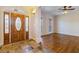 Stunning foyer with decorative leaded glass front door, natural light and hardwood floors at 6020 Cochran Mill Rd, Chattahoochee Hills, GA 30268