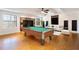 Finished basement game room with pool table, sofa, and natural light at 6020 Cochran Mill Rd, Chattahoochee Hills, GA 30268