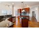Spacious kitchen features dark granite countertops, stainless steel appliances and hardwood floors at 6020 Cochran Mill Rd, Chattahoochee Hills, GA 30268