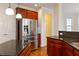 Kitchen featuring stainless steel appliances, granite countertops, and custom wood cabinetry at 6020 Cochran Mill Rd, Chattahoochee Hills, GA 30268