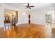 Bright living room with hardwood floors, open layout, and access to other rooms at 6020 Cochran Mill Rd, Chattahoochee Hills, GA 30268