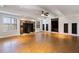 Spacious living room featuring a fireplace, wood floors, and recessed lighting at 6020 Cochran Mill Rd, Chattahoochee Hills, GA 30268