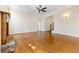 Spacious living room features hardwood floors, fireplace, and ceiling fan at 6020 Cochran Mill Rd, Chattahoochee Hills, GA 30268