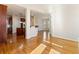 Open-concept living space showcasing hardwood floors, natural light, and a seamless flow to the kitchen area at 6020 Cochran Mill Rd, Chattahoochee Hills, GA 30268