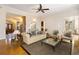Open-concept living room showcasing hardwood floors and a comfortable seating arrangement at 6020 Cochran Mill Rd, Chattahoochee Hills, GA 30268