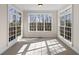 Sunny sitting room with multiple windows allowing abundant light to fill the space at 6020 Cochran Mill Rd, Chattahoochee Hills, GA 30268