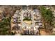 Aerial view of a residential neighborhood with tree-lined streets and well-maintained homes at 1250 Atherton Park, Roswell, GA 30076