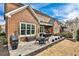 Outdoor patio with furniture, professional landscaping, and view of the brick exterior at 1250 Atherton Park, Roswell, GA 30076