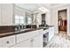 Main bathroom with granite countertops, double sinks, and closet access at 1250 Atherton Park, Roswell, GA 30076