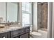 Bathroom features granite countertop, vanity, white toilet and shower-tub with gray tile surround at 1250 Atherton Park, Roswell, GA 30076