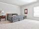 Serene bedroom with a patterned bedspread, a side table, and neutral colors at 1250 Atherton Park, Roswell, GA 30076