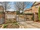 Atherton Park entrance features a decorative brick and iron gate, beautiful landscaping and brick paved drive at 1250 Atherton Park, Roswell, GA 30076