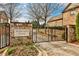 Community entrance with stone signage and wrought iron gate at 1250 Atherton Park, Roswell, GA 30076
