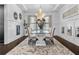 Elegant dining room with a modern chandelier, decorative wall art, and a stylish glass-top table at 1250 Atherton Park, Roswell, GA 30076