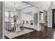 Bright dining room featuring a glass-top table, statement chandelier, and sophisticated decor elements at 1250 Atherton Park, Roswell, GA 30076