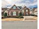 Beautiful two-story brick home featuring a well-manicured lawn, an inviting driveway, and decorative shutters at 1250 Atherton Park, Roswell, GA 30076