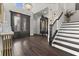 Grand foyer featuring a staircase, chandelier, and elegant decor at 1250 Atherton Park, Roswell, GA 30076