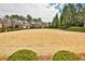 Expansive front lawn showcases the property's curb appeal with mature trees and manicured landscaping at 1250 Atherton Park, Roswell, GA 30076